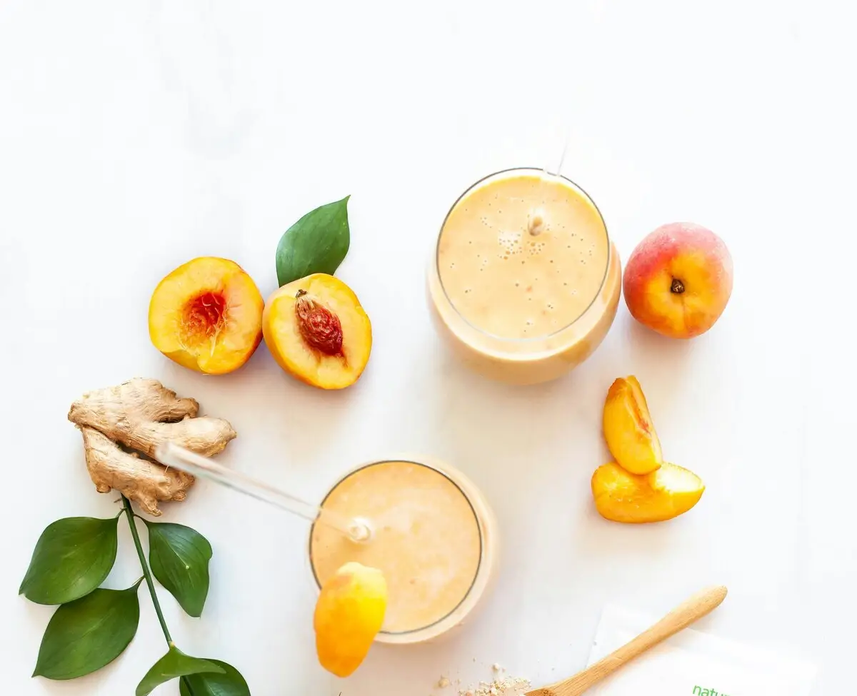 Fresh protein smoothie with peaches and ginger for athletic recovery